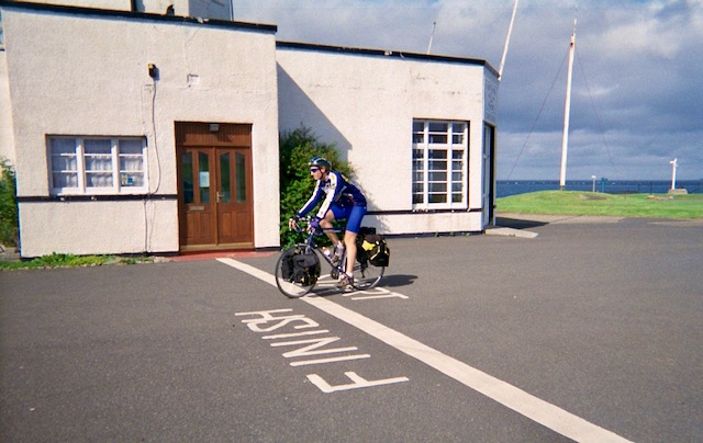 Me on the cycle crossing the finish line